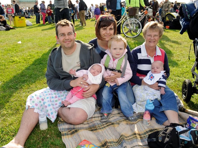 The Evening Celebrations at The Olympic Torch Relay as it came to Southsea Common early on Sunday evening 
There were stage acts as well as Rizzle Kicks a pop duo,  as 65000 people enjoyed the free spectacle 
(left to right) Southsea family with 15 week old twins -  Dad Ben George (37) with Evie, mum  Clare George (36), with Poppy (2), and grandmother Joan Wedley (64) with twin Jack 
Picture: Malcolm Wells (122387-1117)