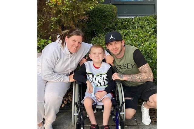 Jake Carson-Blake, 8, from Waterlooville has stage 4 Hodgkin's Lymphoma.Picturerd with mum Ali and dad Nathan Picture: Ali Carson-Blake