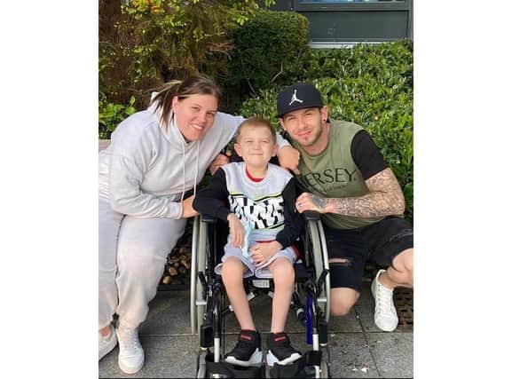 Jake Carson-Blake, 8, from Waterlooville has stage 4 Hodgkin's Lymphoma.

Picturerd with mum Ali and dad Nathan
 Picture: Ali Carson-Blake
