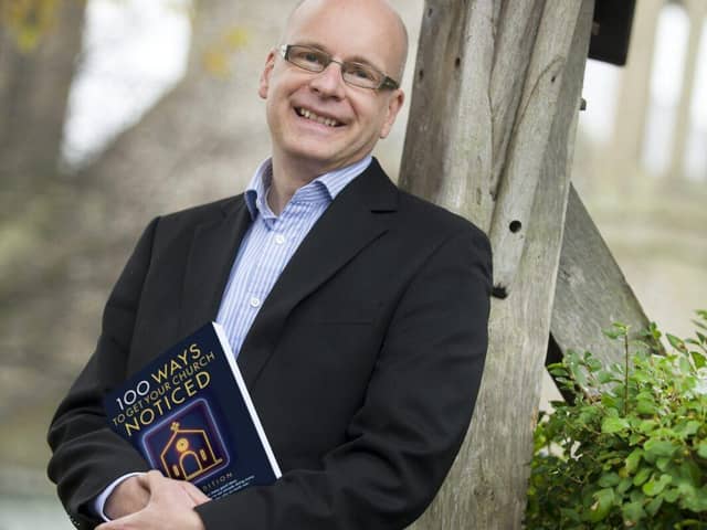 Neil Pugmire with his book '100 Ways To Get Your Church Noticed'