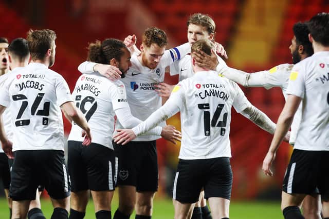 Pompey's players celebrate Tom Naylor's second-half goal in Tuesday night's 3-1 win at Charlton. Picture: Joe Pepler