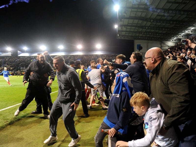Fans celebrate at Fratton Park after a nail biting game which secured victoryPicture: Sarah Standing (160424-7645)