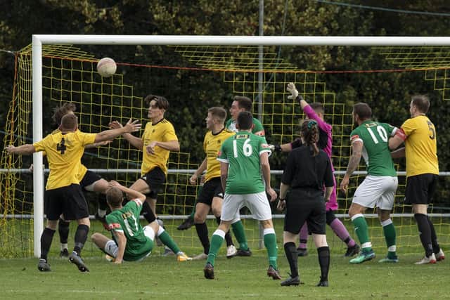 James Franklyn (on ground, left) forces home Moneyfields' FA Vase leveller at Littlehampton. Picture: Chris Hatton