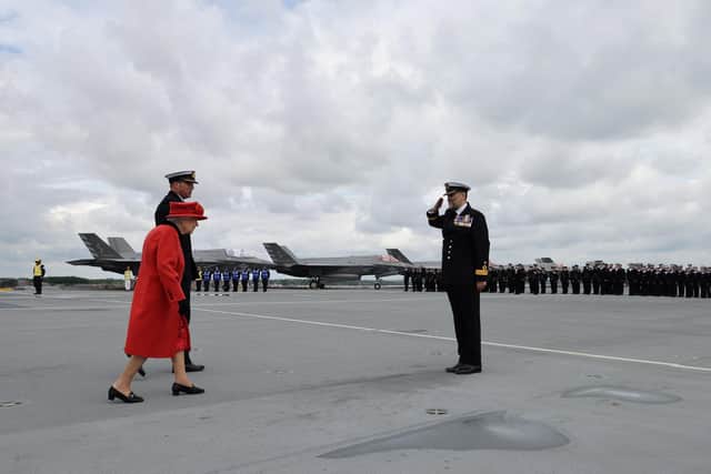 Her Majesty The Queen being greeted by the Commander UK Strike Group, Commodore Moorhouse on board HMS Queen Elizabeth