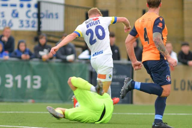 Flashpoint - Tommy Wright is about to be sent off for this challenge on Slough keeper Jon North. Picture: Martyn White
