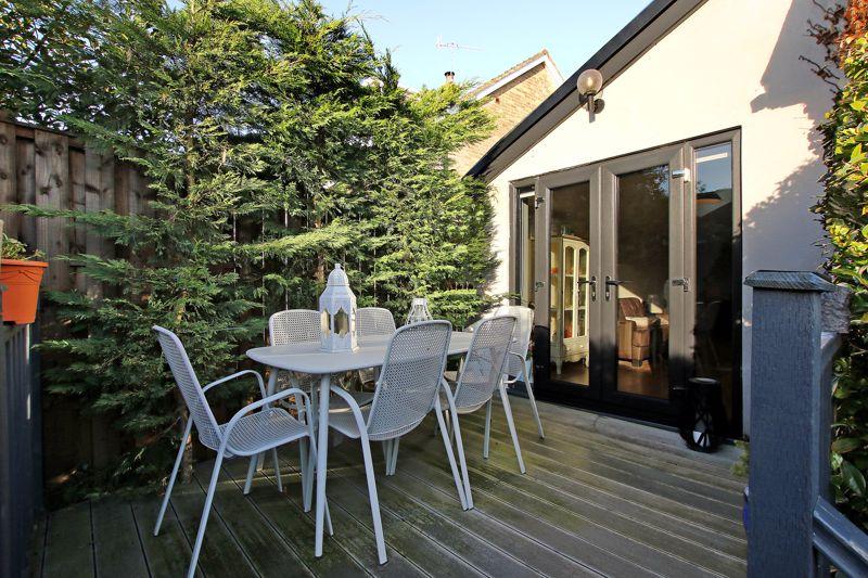 The garden terrace is a pleasant spot, with decking for outdoor furniture.