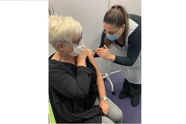 Janice Fletcher from Portsmouth getting her Covid booster jab at Lalys Pharmacy