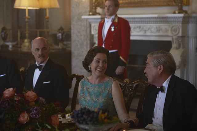 Olivia Colman, as The Queen, pictured in the State Dining Room at Belvoir Castle during filming of Netflix series The Crown. Picture: Des Willie / Netflix