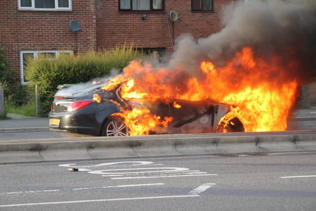The car on fire. Picture: Bob Hind