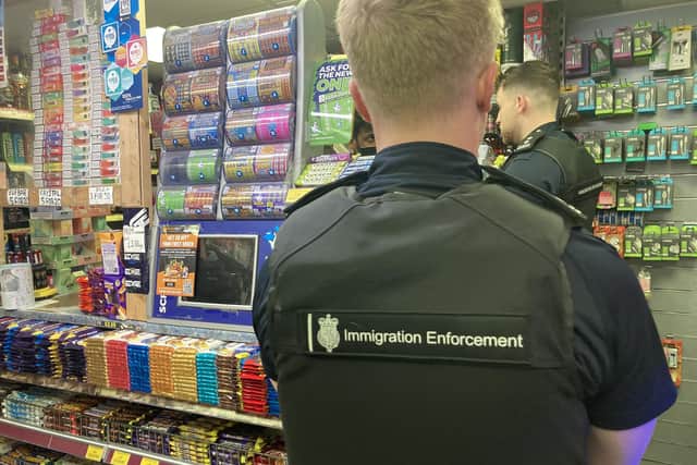Immigration officers arrested five suspected illegal workers at a Stamshaw house and newsagents Twyford News. Pic Steve Deeks