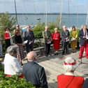 Paul Covell, facing camera, second right, reads the roll of honour. A Memorial Service at Hayling Island Sailing Club for the Combined Operations Pilotage PartiesPicture: Chris  Moorhouse (050624-071)
