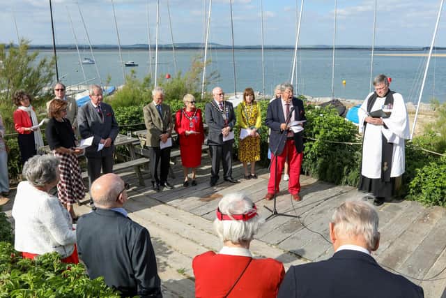 Paul Covell, facing camera, second right, reads the roll of honour. A Memorial Service at Hayling Island Sailing Club for the Combined Operations Pilotage PartiesPicture: Chris  Moorhouse (050624-071)
