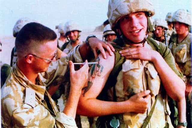 A member of "B" Company of the Royal Scots receiving an injection in Saudi Arabia against the effects of chemical attack. Photo: PA