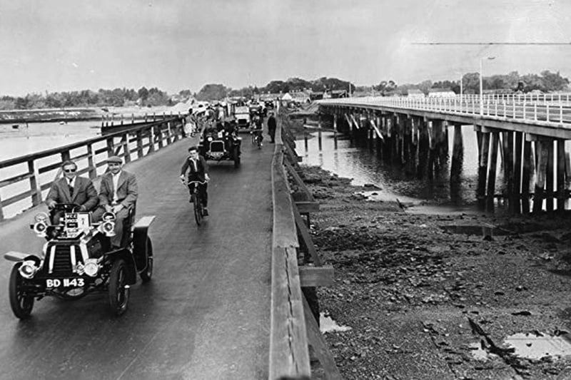 Opening of the new Langstone Bridge in 1956. A procession of vintage cars passes over the old Langstone Bridge for the last time.