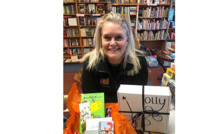 Sarah Veal from The Book Shop in Lee-on-the-Solent, pictured with one of the store's 'positivity boxes'. Picture: Supplied