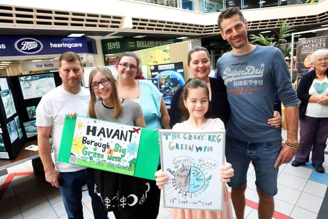 Pictured are winners Olivia Hill-Burnett, 8, (in pink) and Rebecca Nastri, 13, (in black and white with glasses) with their families behind.

Picture: Sam Stephenson