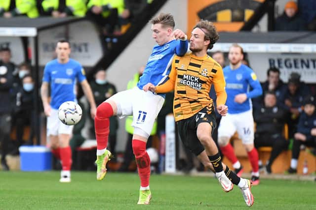 Pompey's Ronan Curtis battles for possession with Ben Worman in the Bank Holiday Monday encounter with Cambridge United. Picture: Dennis Goodwin/ProSportsImages
