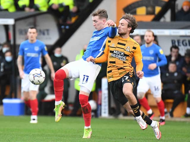 Pompey's Ronan Curtis battles for possession with Ben Worman in the Bank Holiday Monday encounter with Cambridge United. Picture: Dennis Goodwin/ProSportsImages