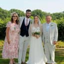 Sean and Karen proudly displaying their combined weight loss of 8 stone 12 lbs at their sons wedding