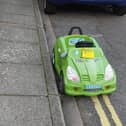 A toy car was given a penalty charge notice in jest for parking on yellow lines on Durban Road, Fratton. Pic: John Day.