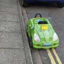 A toy car was given a penalty charge notice in jest for parking on yellow lines on Durban Road, Fratton. Pic: John Day.