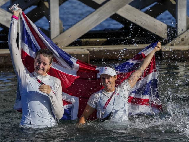 Eilidh Mcintyre, left, and Hannah Mills celebrate after winning the 470 women's gold medal during the 2020 Summer Olympics. Picture: AP Photo/Bernat Armangue