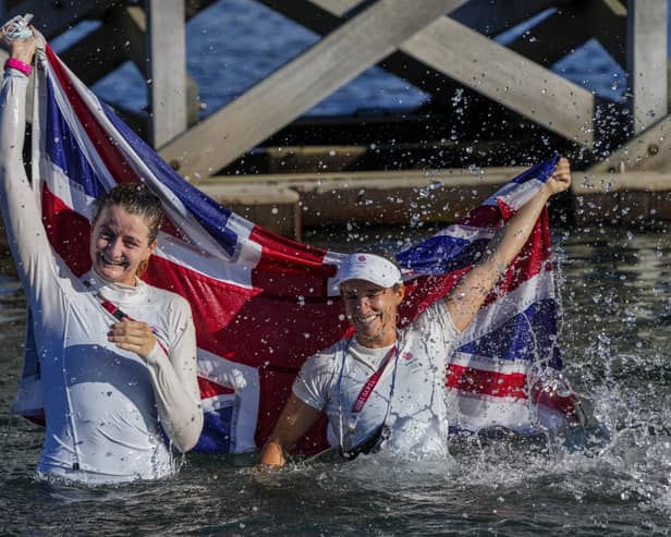 Eilidh Mcintyre, left, and Hannah Mills celebrate after winning the 470 women's gold medal during the 2020 Summer Olympics. Picture: AP Photo/Bernat Armangue