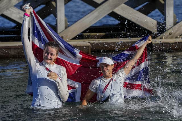 Eilidh Mcintyre, left, and Hannah Mills celebrate after winning the 470 women's gold medal during the 2020 Summer Olympics. Picture: AP Photo/Bernat Armangue