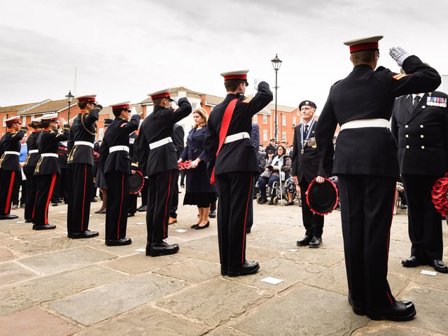 Pictured is: Royal Marine Cadets salute after passing the wreaths to the VIPs. Picture: Keith Woodland (190621-228).