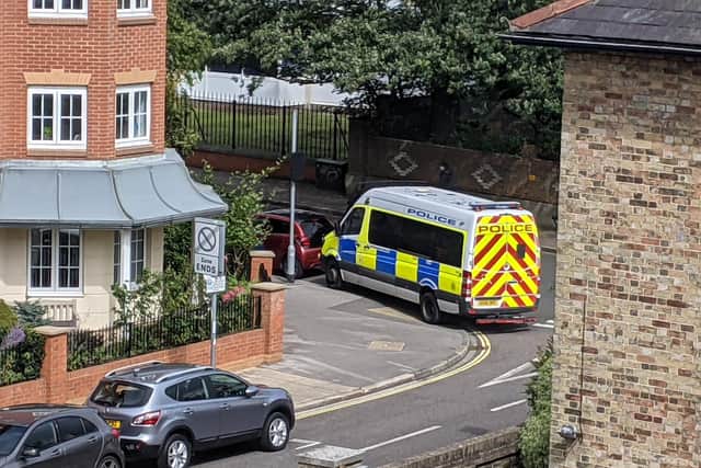 The police van parked on the corner where the altercation happened