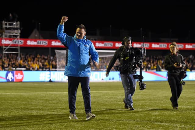 Paul Doswell salutes the Sutton fans ahead of his club's FA Cup fifth round tie with Arsenal in February 2017. Photo by Mike Hewitt/Getty Images.