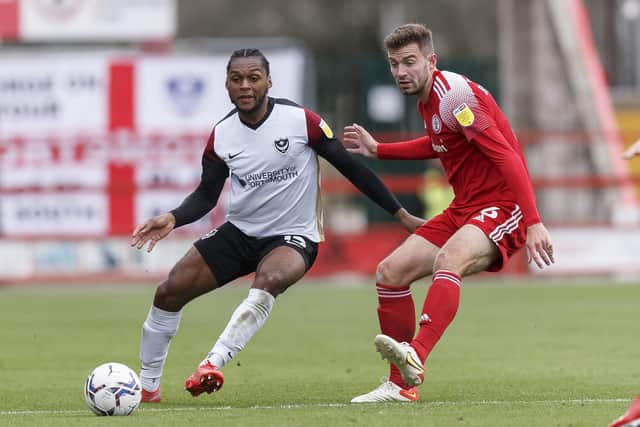 Mahlon Romeo of Portsmouth is challenged by Matt Butcher in Saturday's 2-2 draw at Accrington. Picture: Daniel Chesterton/phcimages.com