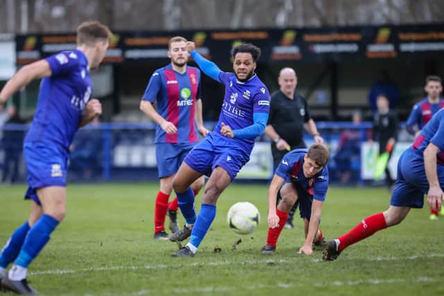 Horndean's two-goal Rudi Blankson (middle) helped set up an FA Cup reunion with Baffins Milton Rovers