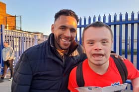 Former Pompey defender Nathan Thompson with Blues fan and Portsmouth Down Syndrome Association ambassador Sam Ford at today's game against Wycombe