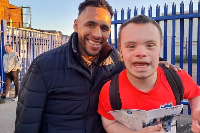 Former Pompey defender Nathan Thompson with Blues fan and Portsmouth Down Syndrome Association ambassador Sam Ford at today's game against Wycombe