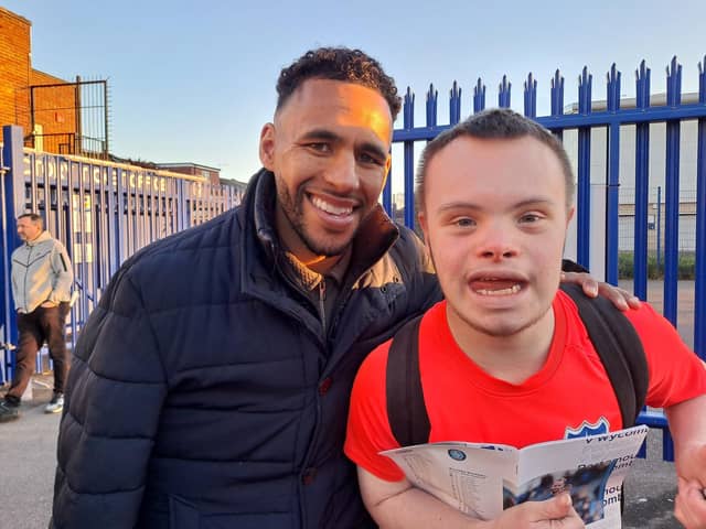 Former Pompey defender Nathan Thompson with Blues fan and Portsmouth Down Syndrome Association ambassador Sam Ford at today's game against Wycombe