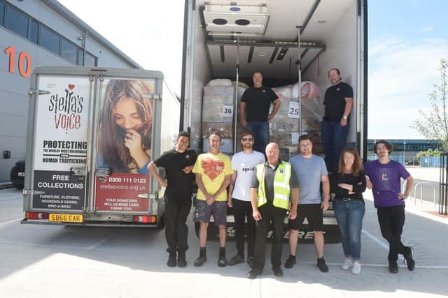 Charity Stella's Voice have been running a donation centre in the Meridian Centre in Havant and on Tuesday, May 17, had an artic lorry loaded up from Spring Business Park in Havant and driven to Romania where it will be taken to a refugee centre which will then be distributed in Ukraine.

Pictured is: (back l-r) Wayne Keeping and Colin Francis with (front l-r) Harris Franklin, Graham Stouse, Rob Burdell, Mark Scanlan from Marsh Plant, Ioan Bisocianu, Romanian driver, Nicky Keeping and Ross Mason. 

Picture: Sarah Standing (170522-7352)