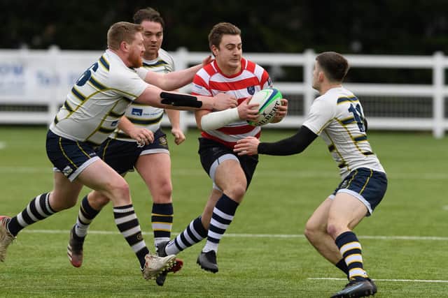 Reuben Knight, centre, was one of three Havant players yellow carded in the defeat at Dorking Picture: Keith Woodland (111221-124)