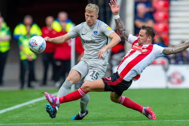 Ross McCrorie battles with Chris Maguire during Pompey's trip to Sunderland in August. Picture: Malcolm MacKenzie