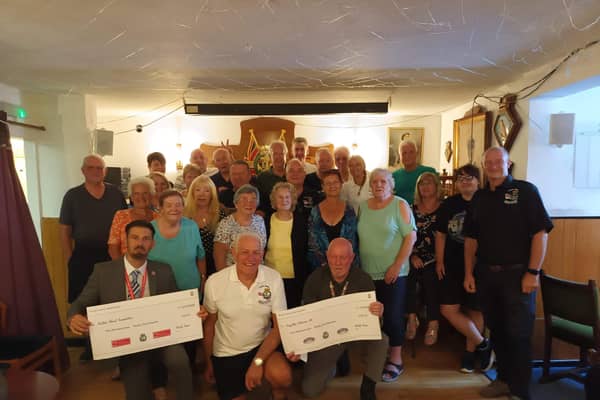 Members of the Waterlooville Royal Naval Association present two £534 cheques to the British Heart foundation and Forgotten Veterans UK.
