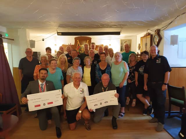 Members of the Waterlooville Royal Naval Association present two £534 cheques to the British Heart foundation and Forgotten Veterans UK.