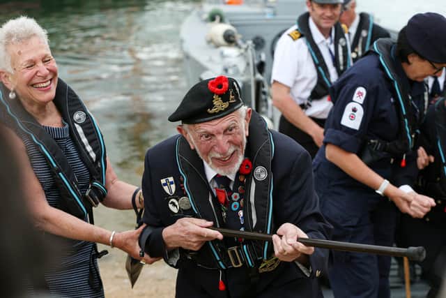 Joe Cattini takes aim at the press with his walking stick as D-Day veterans come ashore in a landing craft at Portsmouth HIstoric Dockyard to mark the 77th anniversary of the decisive wartime event in 2021
Picture: Chris Moorhouse (jpns 060621-17)