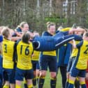 Moneyfields Women manager Karl Watson is hoisted in the air by his players after the club's title win last month