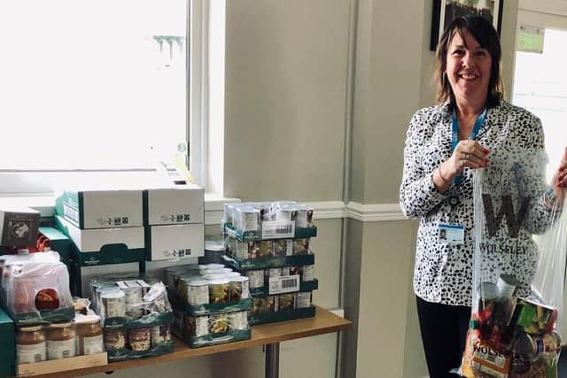 Gosport Borough FC health & safety officer Sue Widdowson packing food parcels for those in need of the town at the club’s Boro’ Bar at Privett Park. Picture by Keith Slater.