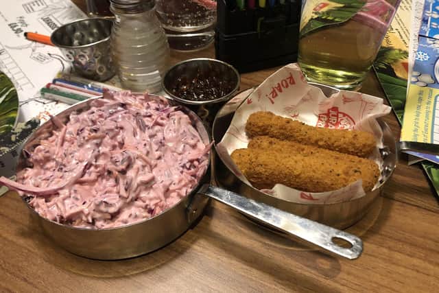 Coleslaw and mozzarella sticks