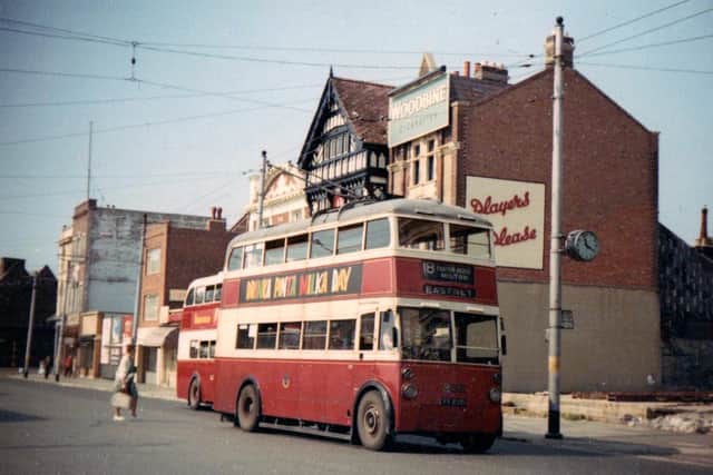 A trolleybus on the war-torn The Hard, Portsea, alongside the site of the former, unusually-named, Bedford in Chase pub.