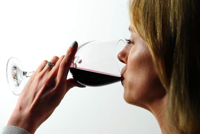 Undated file photo of a woman drinking red wine. Picture by Ian West/PA Wire