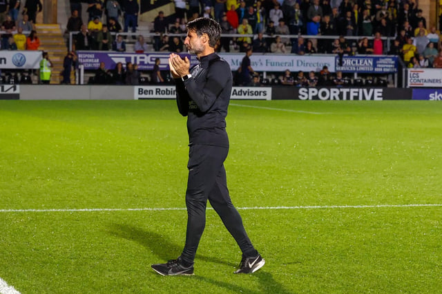 Danny Cowley applauds the travelling faithful before kick-off.