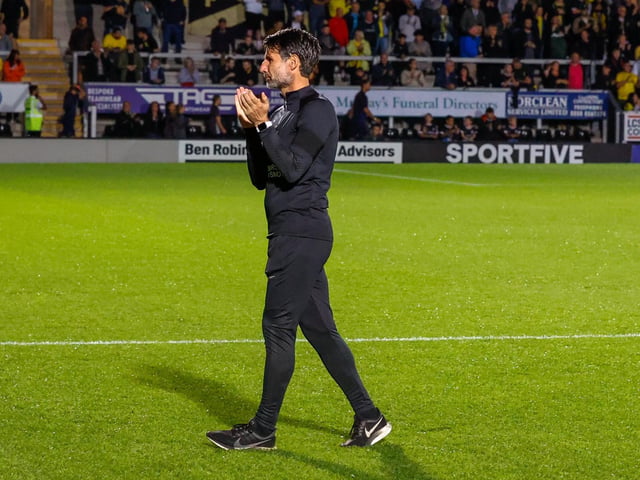 Danny Cowley applauds the travelling faithful before kick-off.
