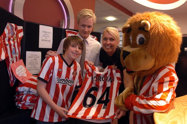 Jack Morgan with some of the football shirts that he donated to Olivers Dental Surgery after an appeal in the Sunderland Echo in 2011. Jack is pictured with l-r Oliver Bailey, Joanne Barella marketing manager and mascot Ollie the Lion.